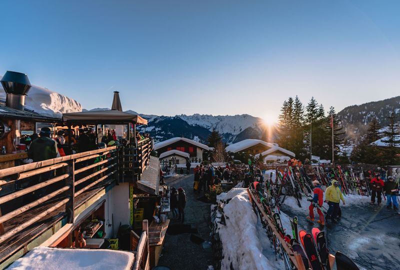 A dusk image of Verbier village streets, taken from above, next to a terrace