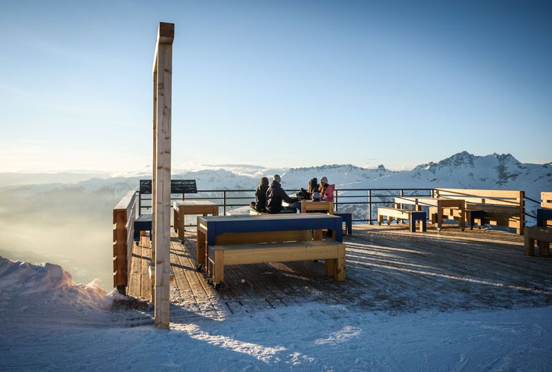 An alpine terrace with grand panoramic mountain views