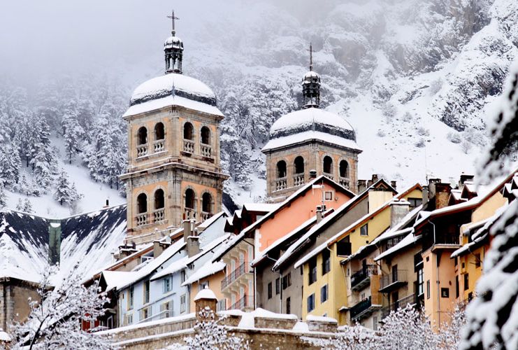 A snowy church and village